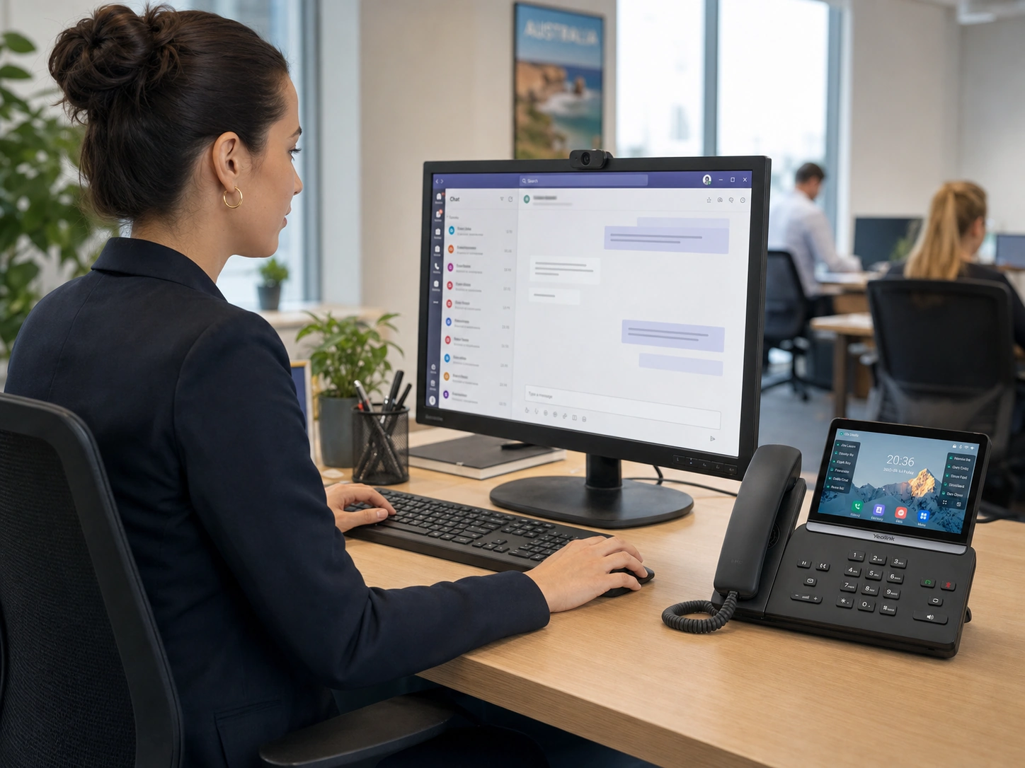 Office team using Microsoft Teams alongside hosted PBX handsets